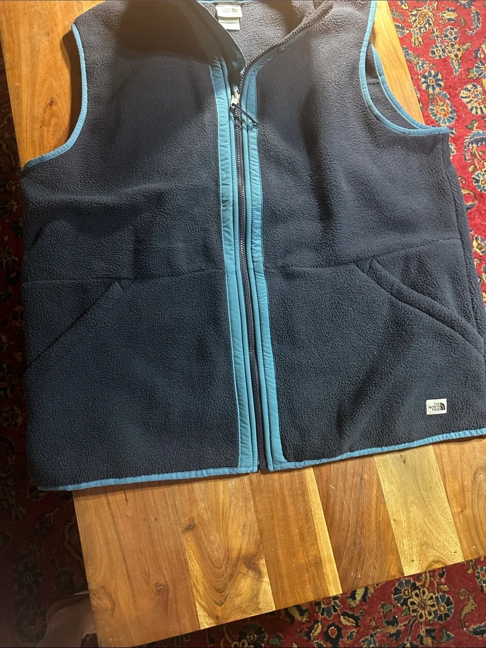 The North Face Navy Fleece Vest with Teal Trim